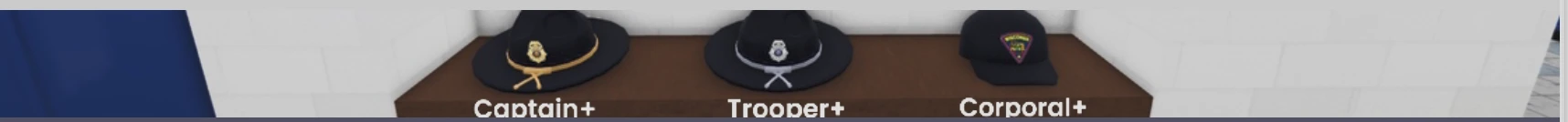 Three hats on a shelf: a campaign hat with gold cord labeled Captain+, a campaign hat with silver cord labeled Trooper+, and a patrol cap labeled Corporal+.